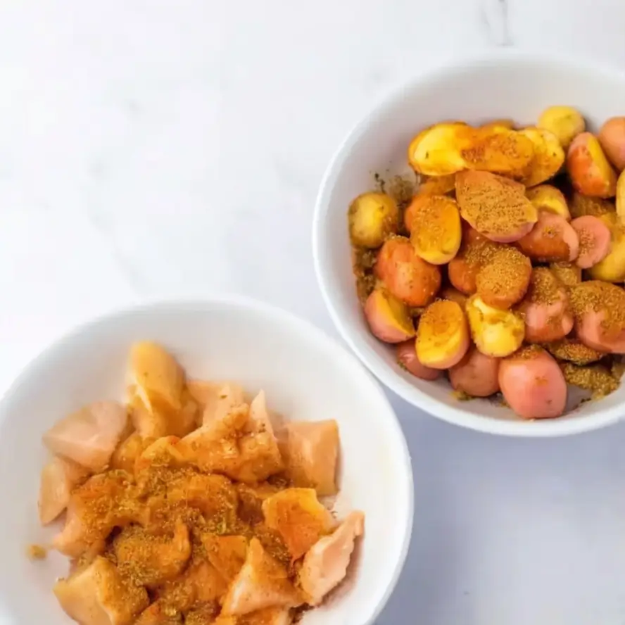 preparing Garlic Parmesan Chicken and Potatoes